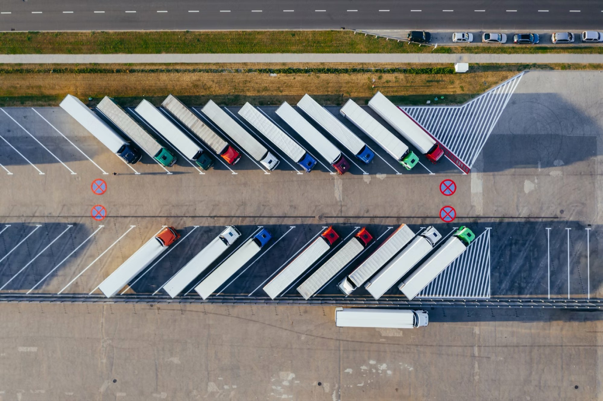 Aerial view of freight trucks staged at a distribution yard